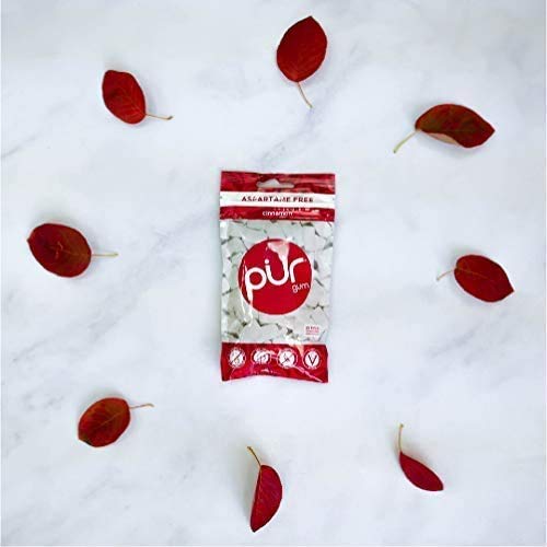 PUR Gum Cinnamon pieces in hand ready to chew