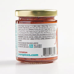 PUR Spices harissa paste scoop ready for spread on pita or toast.