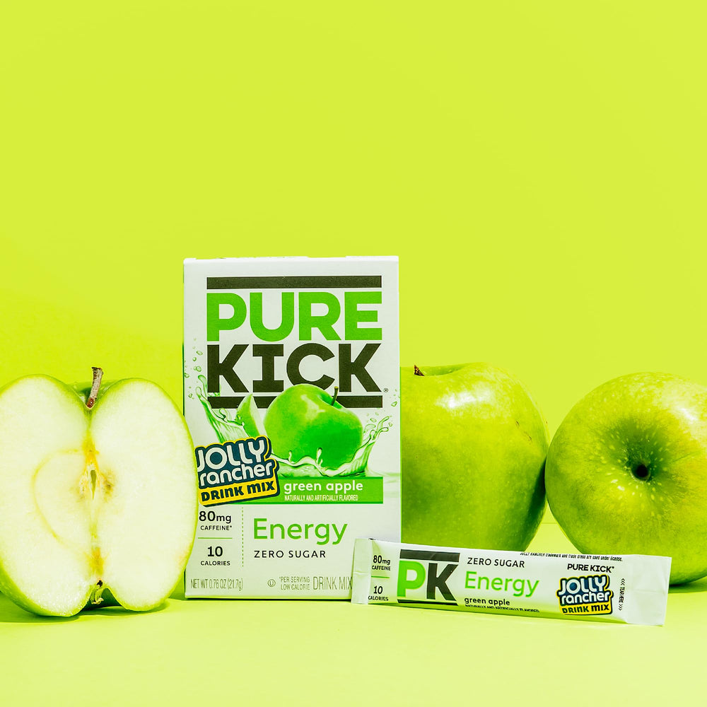 12-box collection of Pure Kick energy mix on a kitchen counter.