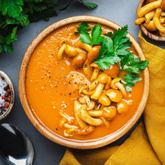 Pure Original Ingredients carrot powder in sauce being stirred during cooking.