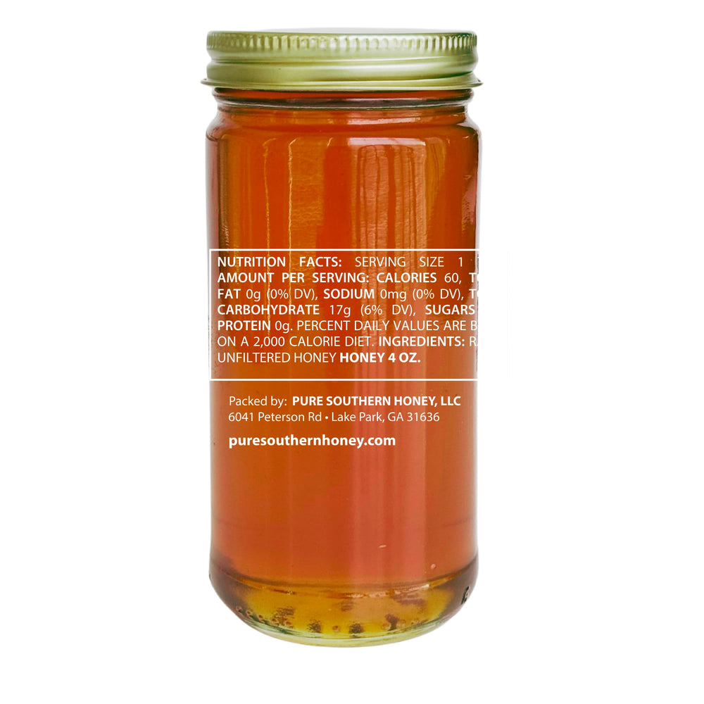 Pure Southern Honey amber jar closeup highlights raw, unheated flavor and handcrafted quality.