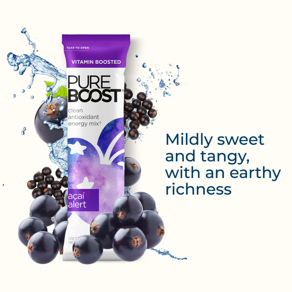 Glass with Pureboost Acai Alert ready-to-drink, refreshing color.