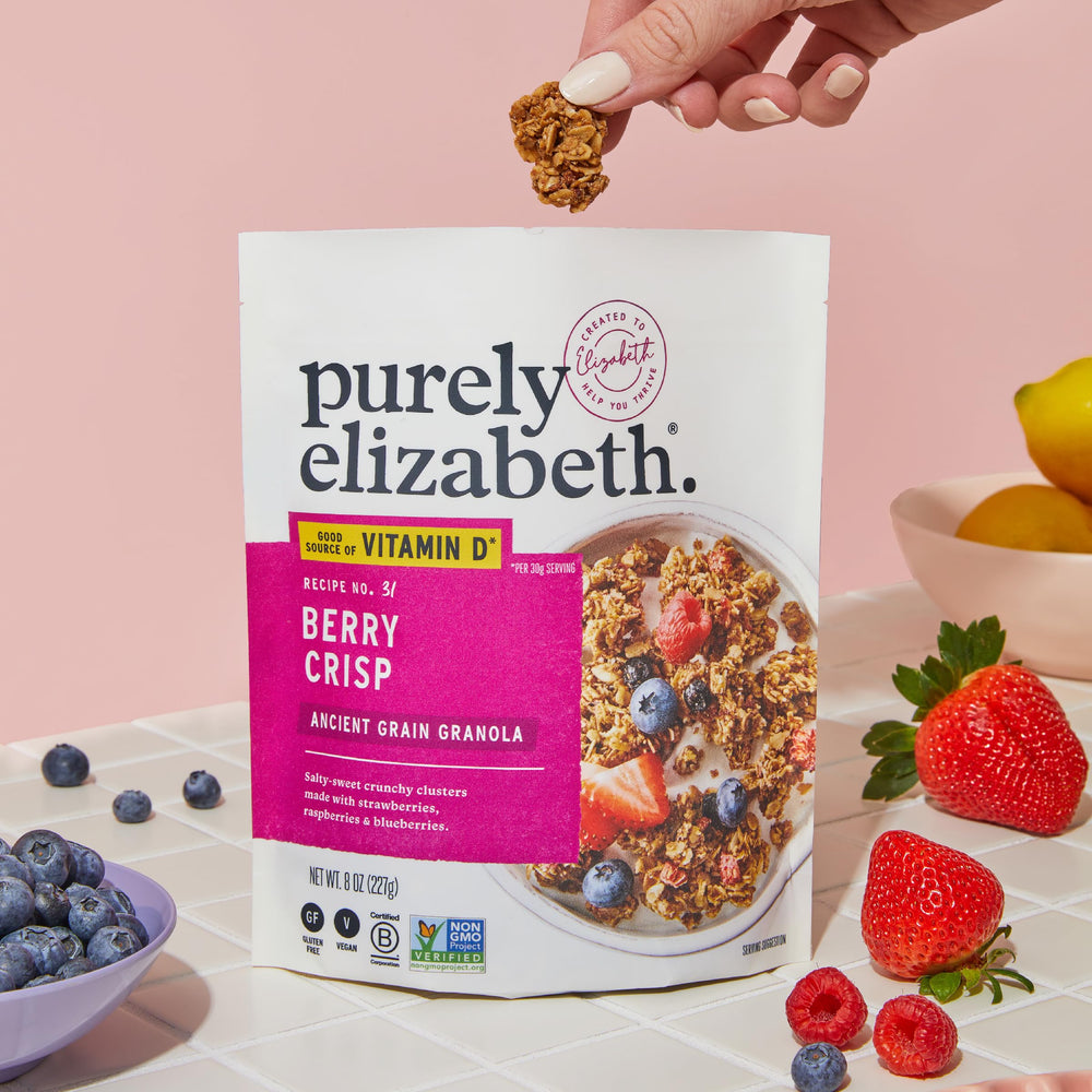 Purely Elizabeth Berry Crisp Granola in a bowl, showing vibrant texture and color.