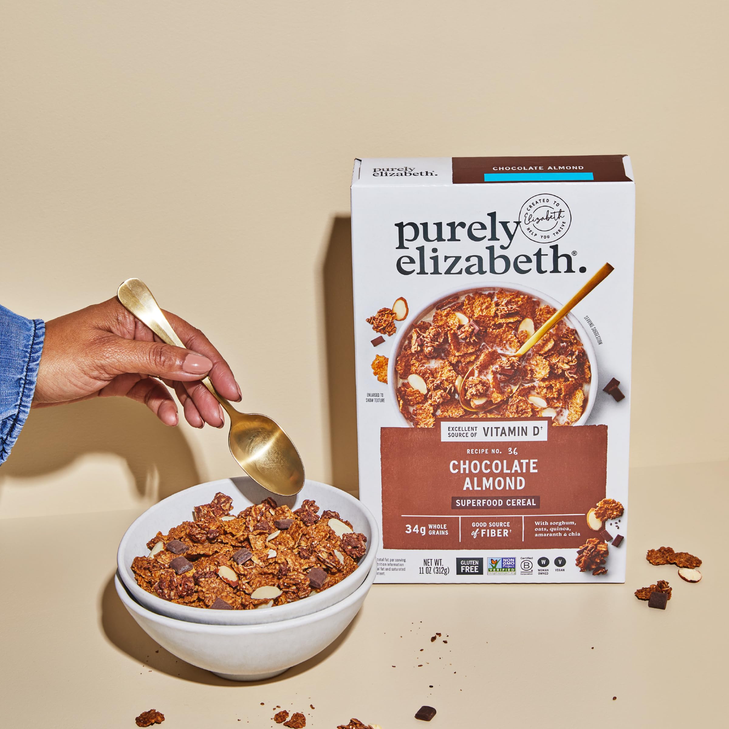 Purely Elizabeth Cereal Chocolate Almond texture close-up shows flakes and nut pieces.
