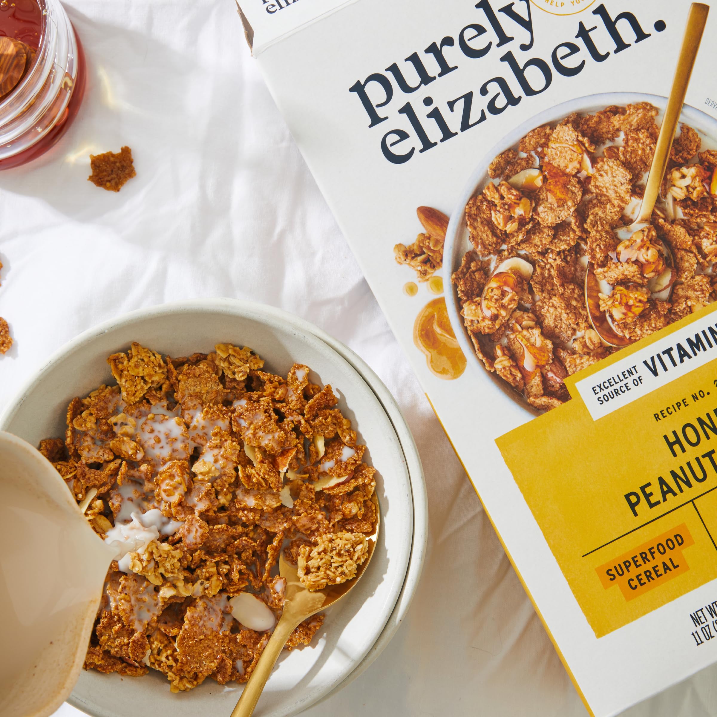 Purely Elizabeth Cereal Honey Peanut Butter jar with ingredient emphasis and premium quality.