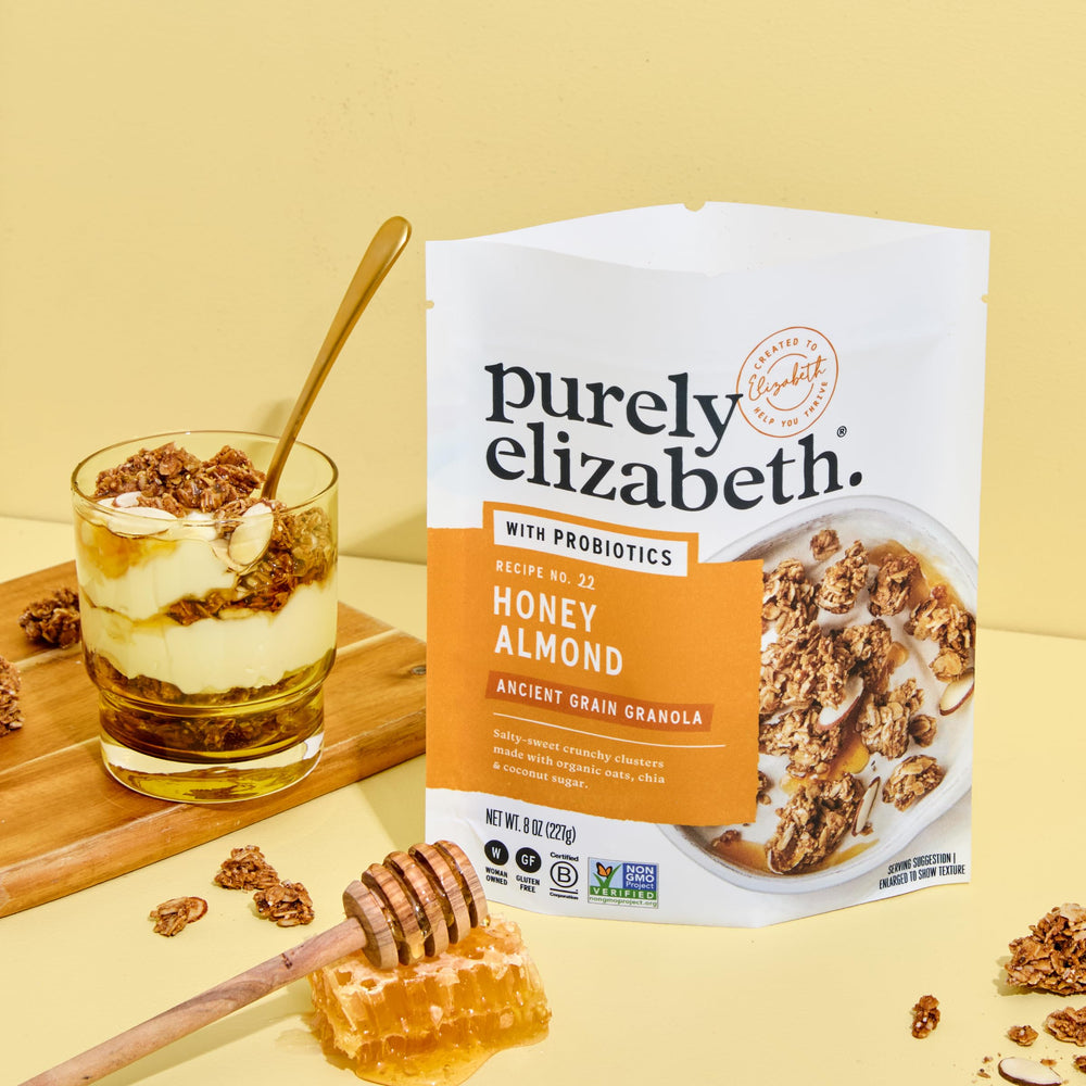 Purely Elizabeth probiotic granola poured over yogurt for breakfast