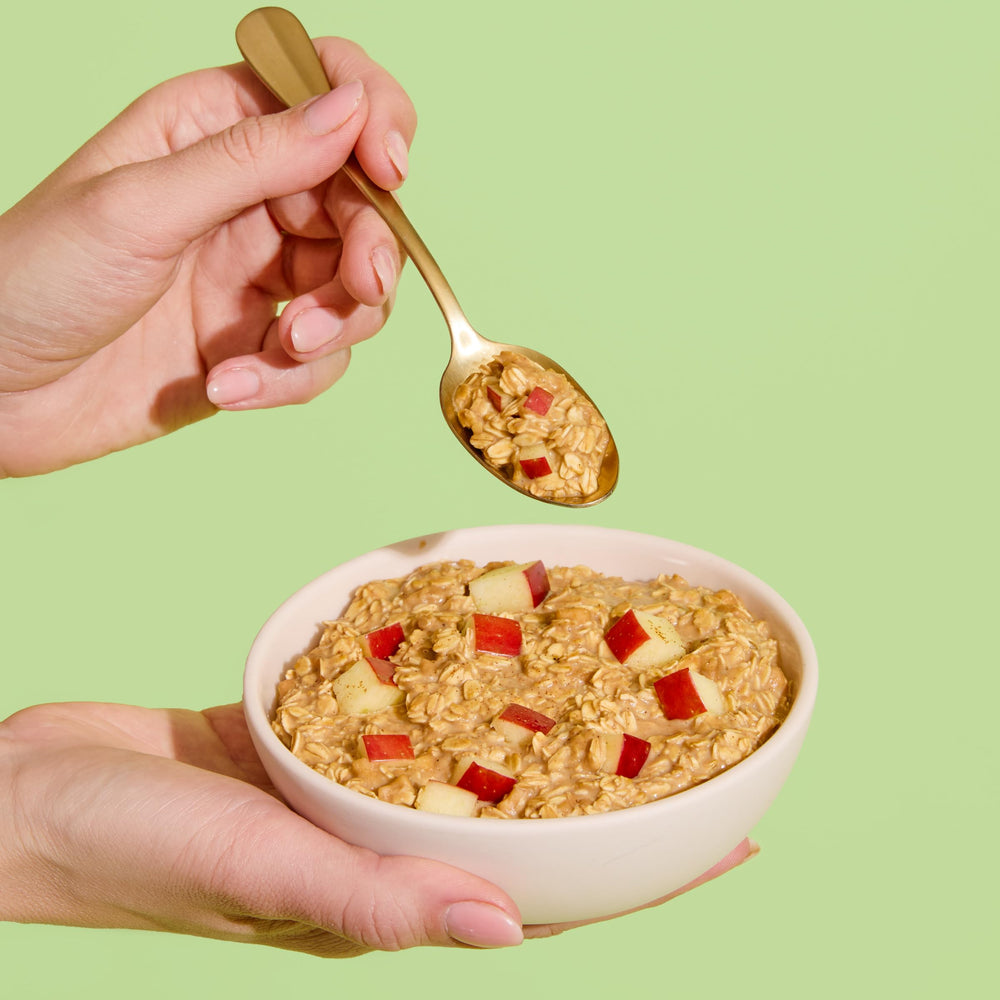 Purely Elizabeth protein oatmeal spoon shot demonstrates quick, protein-rich breakfast option.