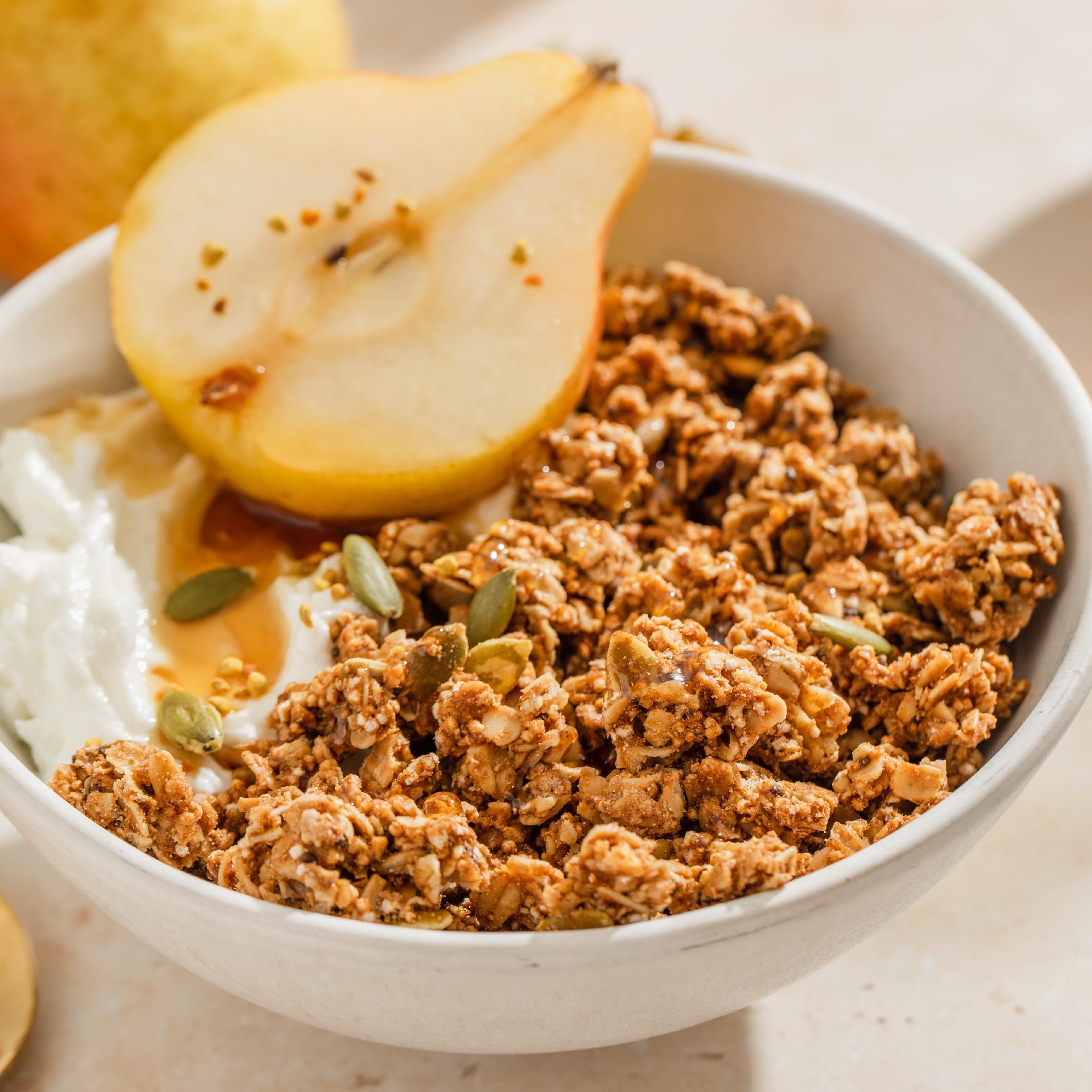 Purely Elizabeth Pumpkin Cinnamon Granola serving bowl suggests versatile topping.