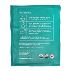 Purity Coffee FLOW sachet being opened for a single-serve brew.