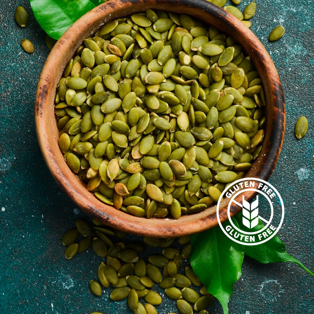 PuroRaw snack-ready pumpkin seeds pour from pouch into hand