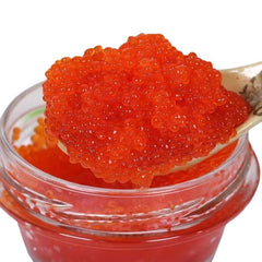 QIXINLIZYY premium salmon roe caviar jar with vibrant red pearls, ideal gift presentation.