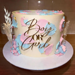 QPARTYFIRE gold acrylic boy or girl topper adds elegant gender reveal flair.