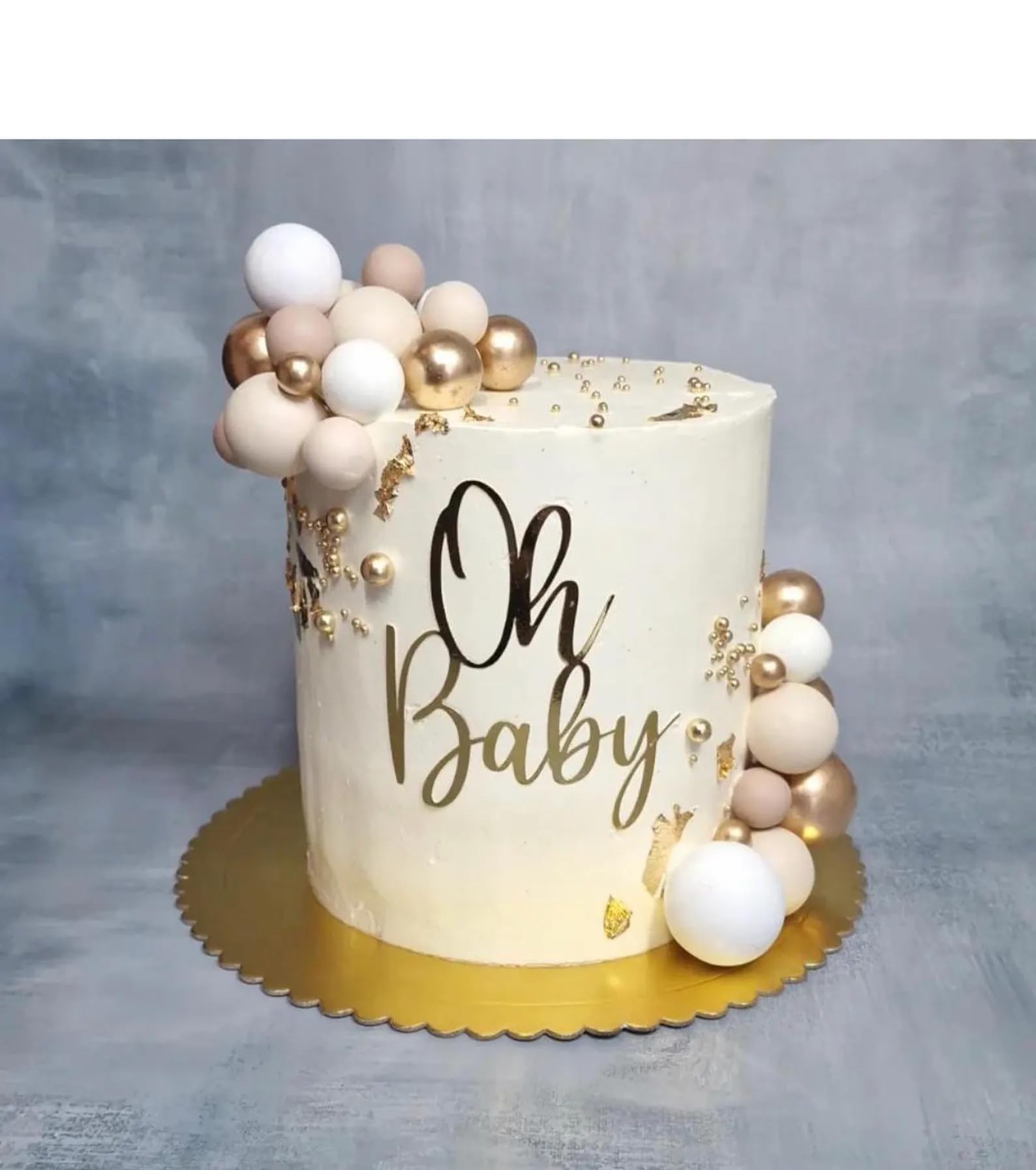QPARTYFIRE Oh Baby gold acrylic cake topper enhancing a baby shower cake with elegance