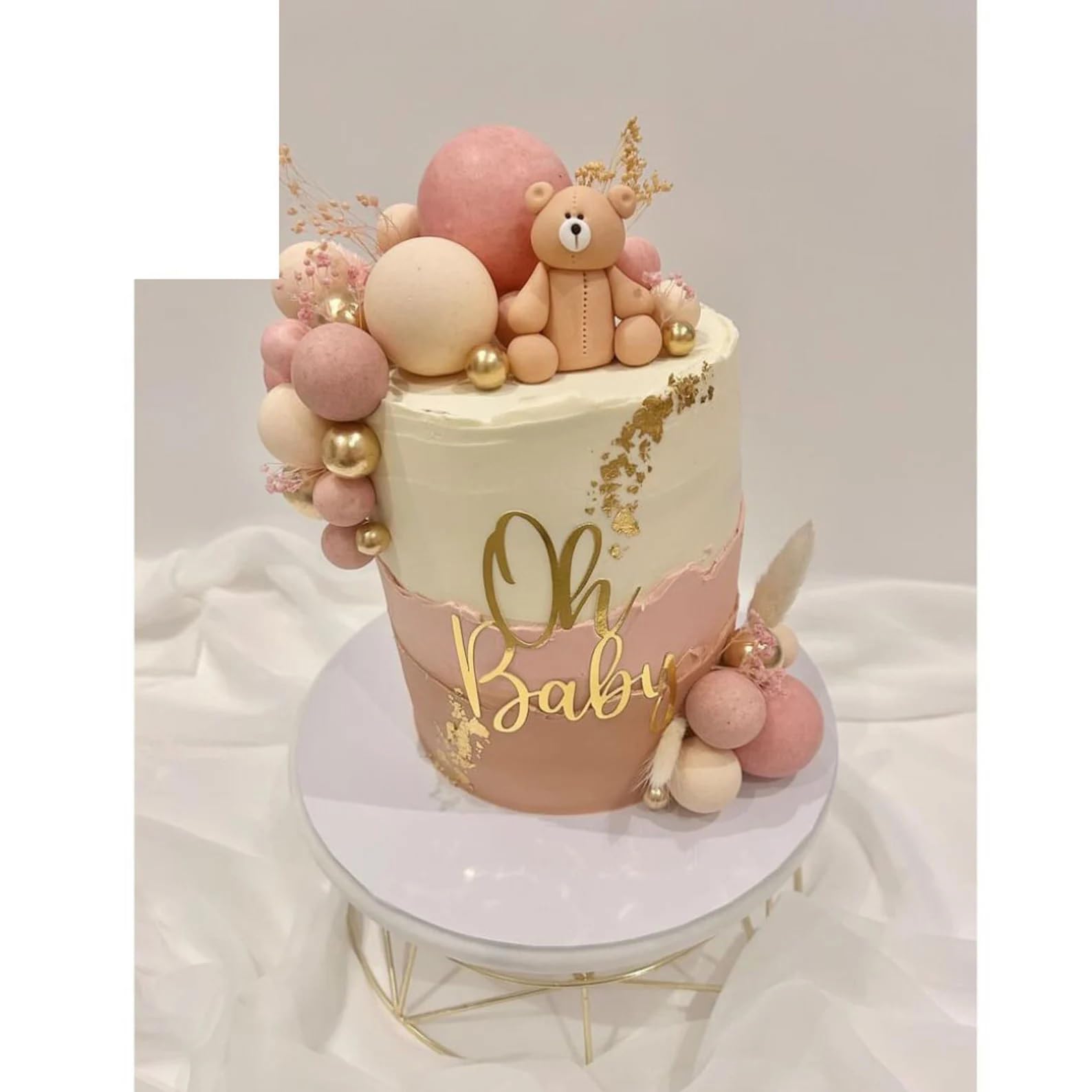 QPARTYFIRE Oh Baby cake topper with script font on a pastel cake for baby shower