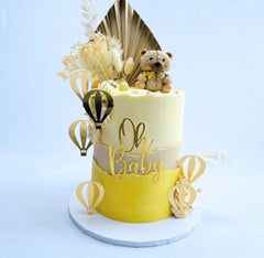 QPARTYFIRE Gold acrylic Oh Baby topper catching light for a refined dessert display