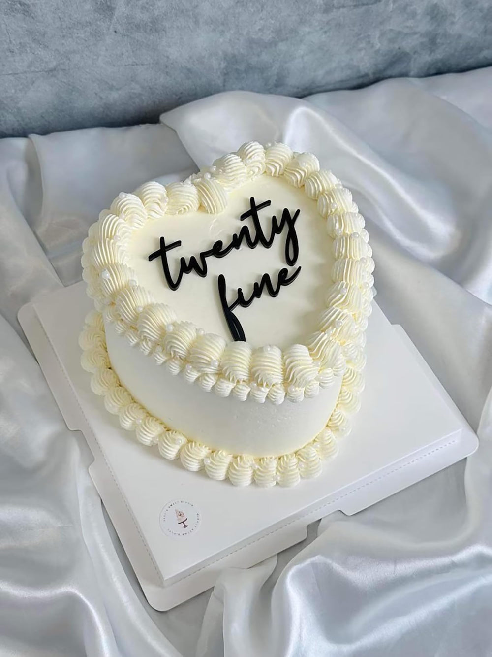 QPARTYFIRE Twenty Fine cake topper on cake adds a stylish focal point for a 20th celebration.