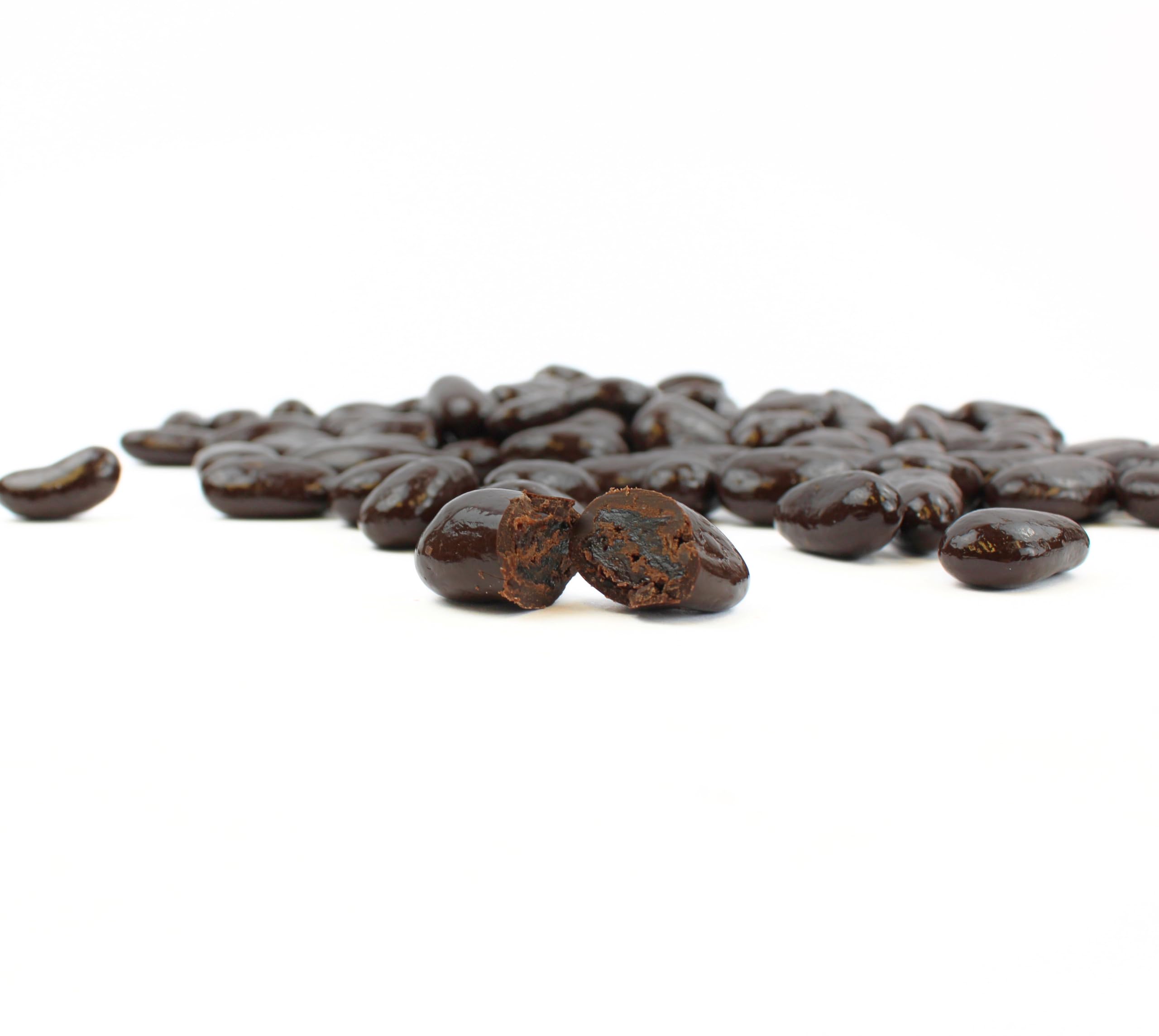 Queen City Candy Cave glossy dark chocolate coating highlights indulgent dessert-ready raisins