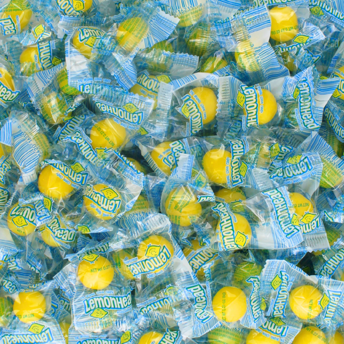 Queen City Candy Cave lemon candy bulk wrap displays individually wrapped lemon heads for easy sharing and gifting.