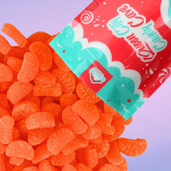 Queen City Candy Cave orange slices in serving dish, ideal party treats.