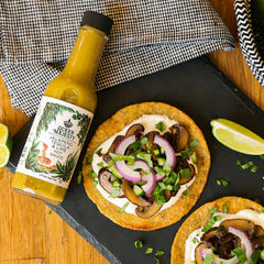 Queen Majesty Jalapeño Tequila Lime hot sauce ingredients—fresh peppers, lime, and agave for depth.