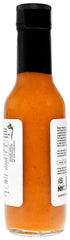 Queen Majesty wings dipping with sauce demonstrates versatile heat for wings.