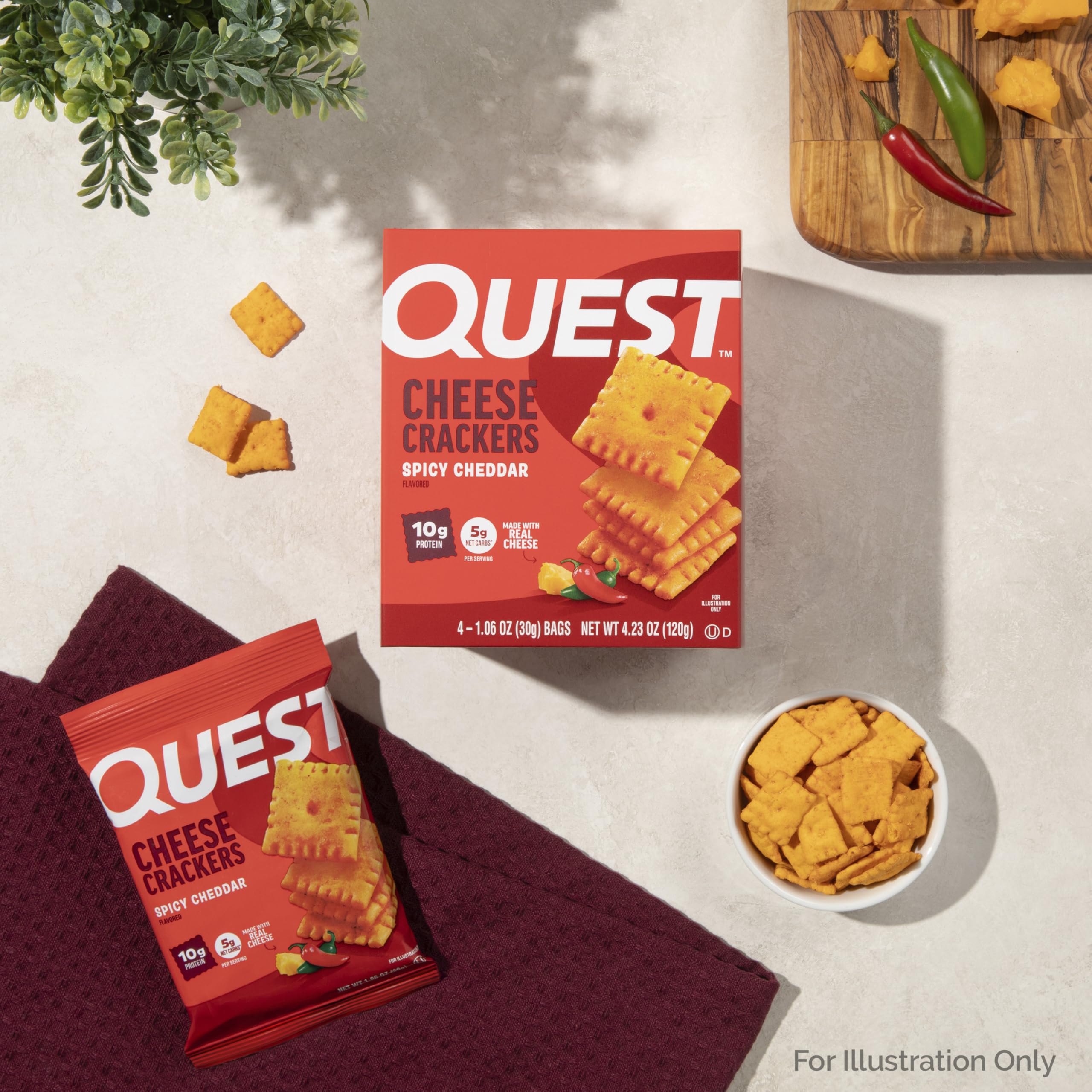Quest Spicy Cheddar Crackers desk drawer image suggests easy office snack.