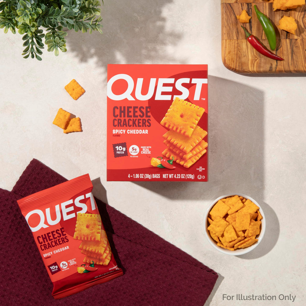 Quest Spicy Cheddar Crackers desk drawer image suggests easy office snack.