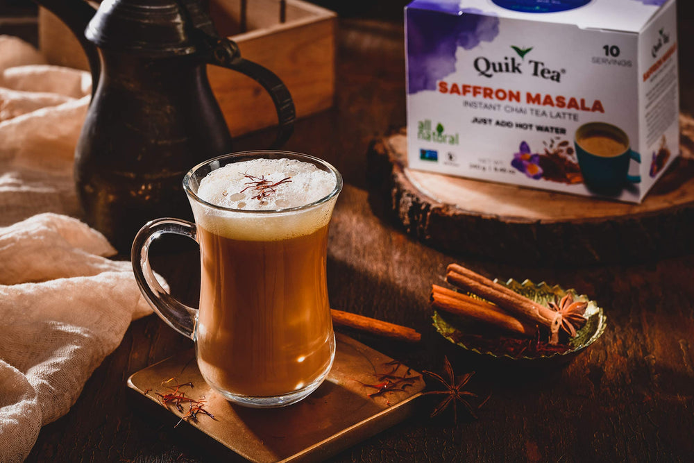 Quik Tea saffron masala chai latte steaming cup evokes cozy, inviting aroma