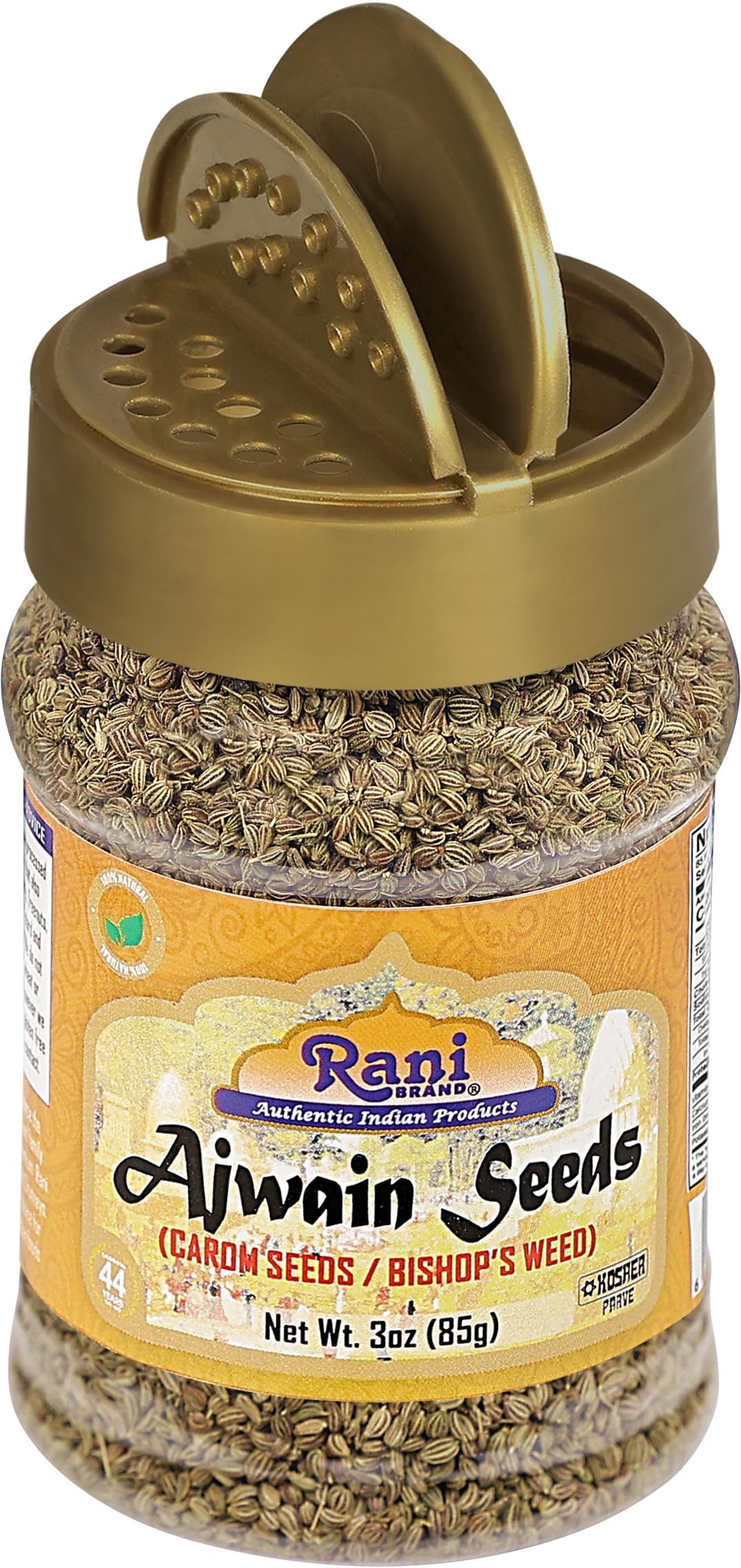 Rani Ajwain seeds near a curry pan, evokes authentic Indian flavor.