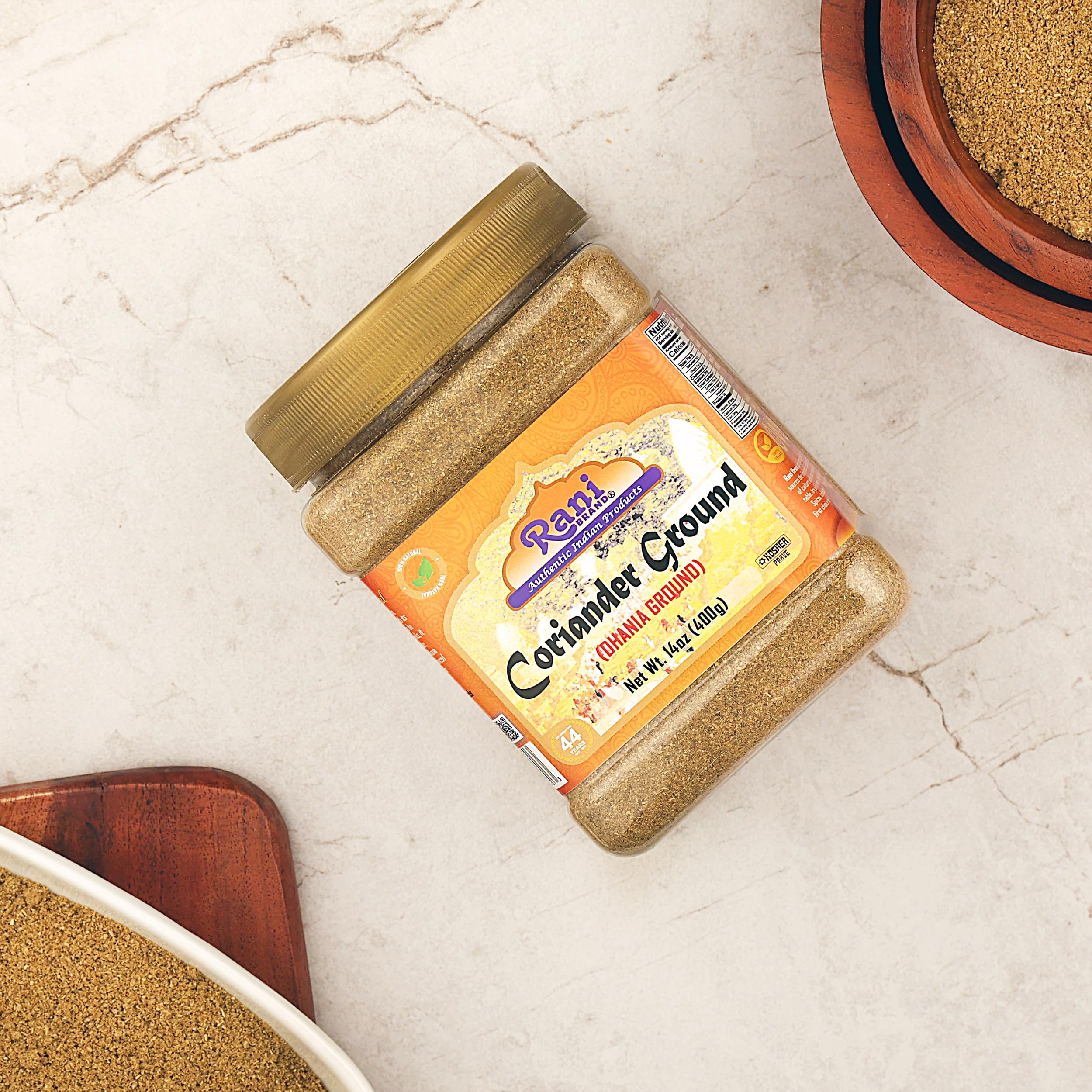 Rani coriander powder on dish, vibrant notes enhancing sauces.