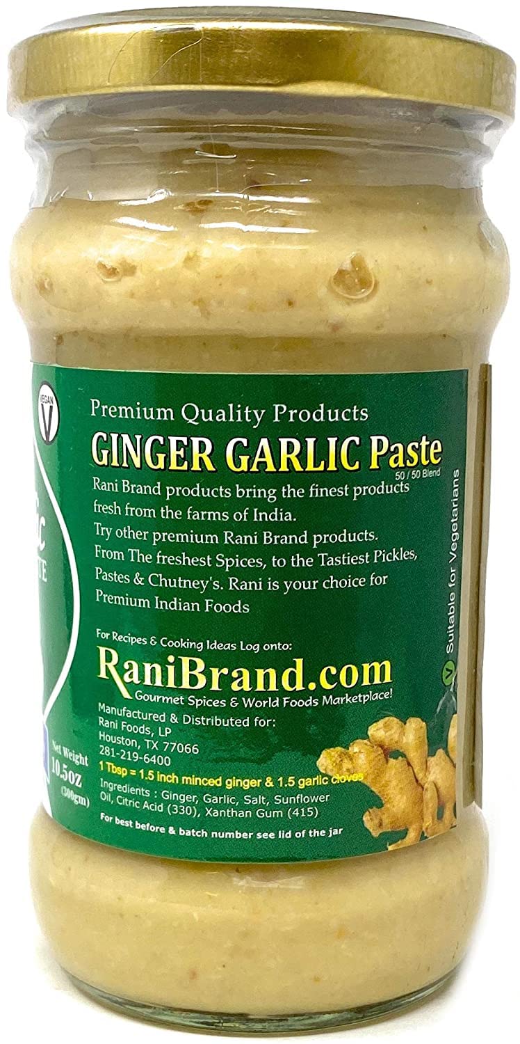 Rani paste on a kitchen counter with fresh ginger and garlic nearby.