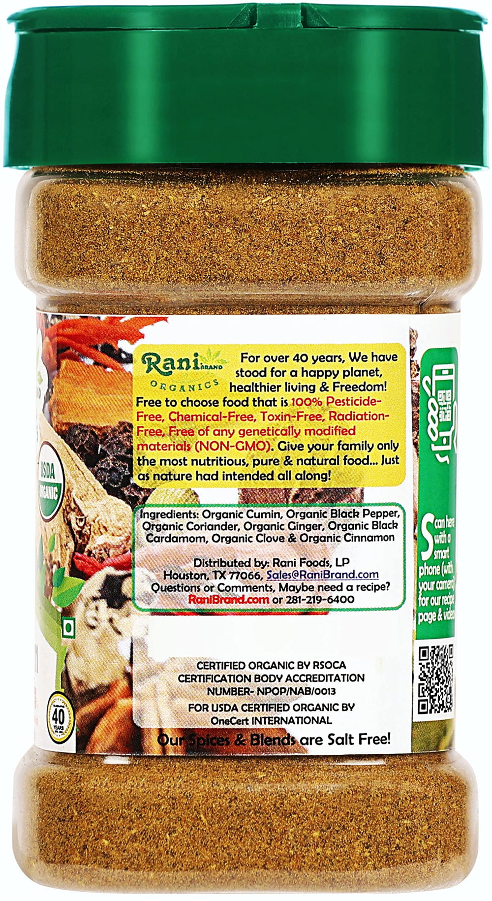 Pouring Rani Garam Masala from the jar to flavor a simmering sauce.