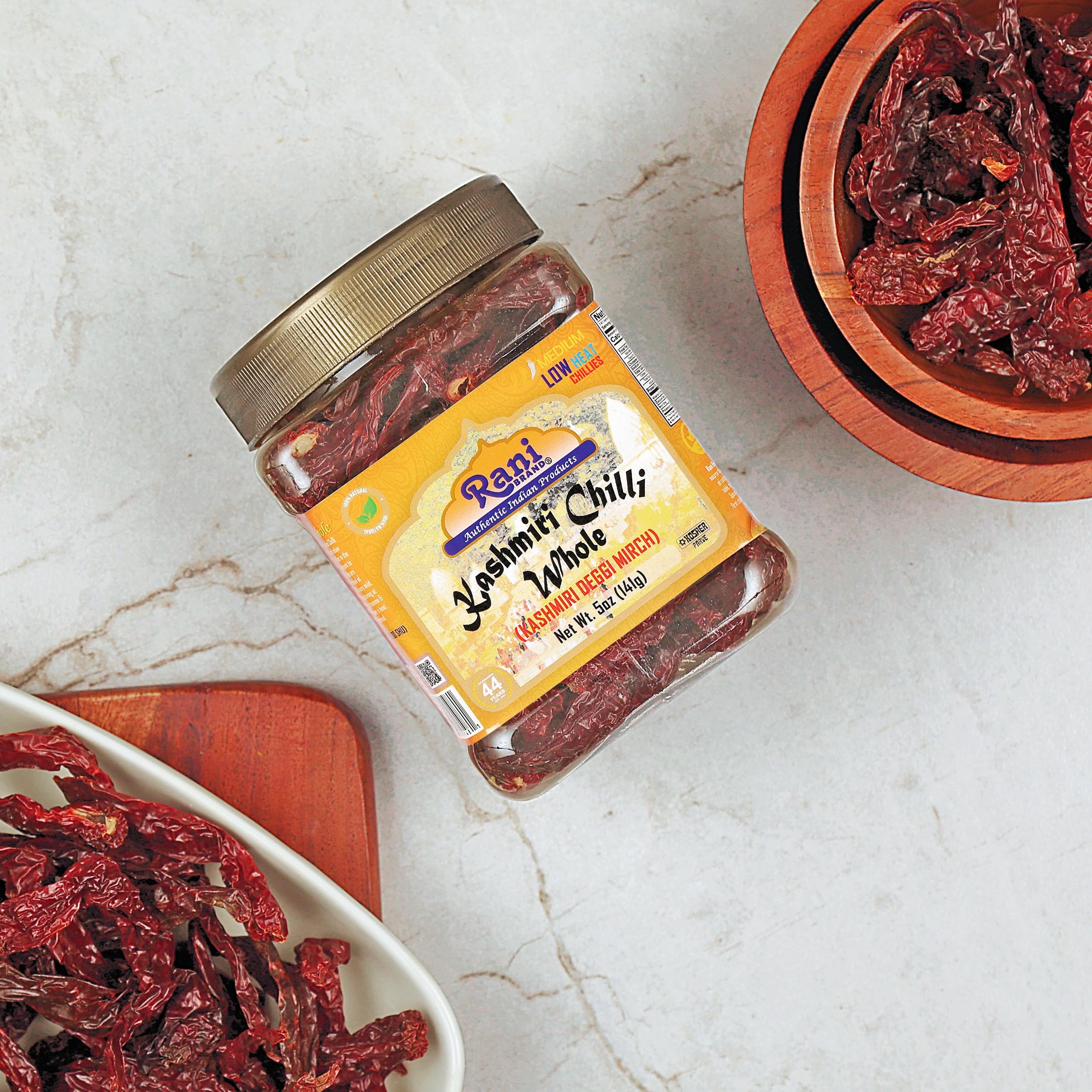 Rani Kashmiri Chilli Whole packaging displayed on a kitchen shelf.