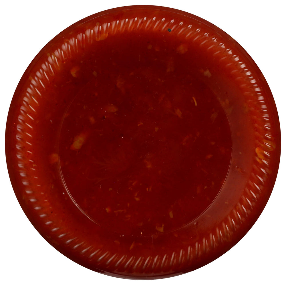Rao's Roasted Garlic Tomato Sauce being poured over pasta invites rich aroma.