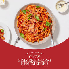 Bottle of Rao's Vodka Sauce poured over pasta