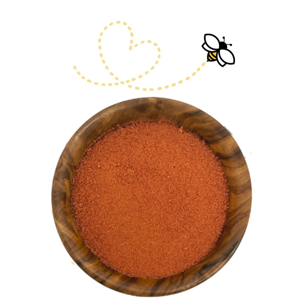 Raw Essentials Tomato Powder in glass jar ready for pantry storage.