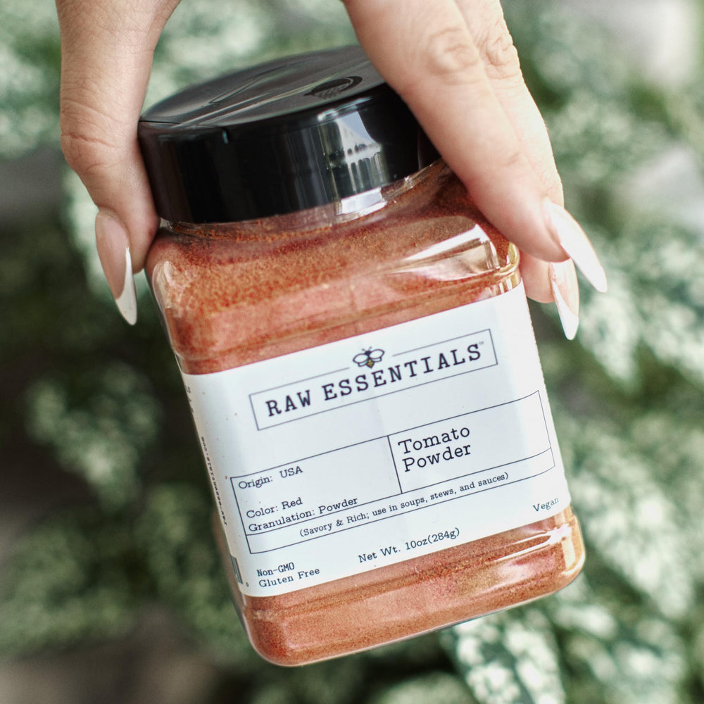 Raw Essentials Tomato Powder packaging closeup highlights clean, non-GMO profile.