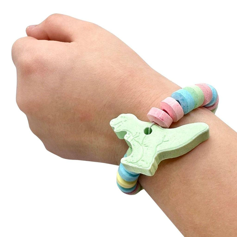 RBBZ Party Dinosaur Candy Bracelets in hand demonstrate easy party favors