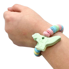 RBBZ Party Dinosaur Candy Bracelets in hand demonstrate easy party favors
