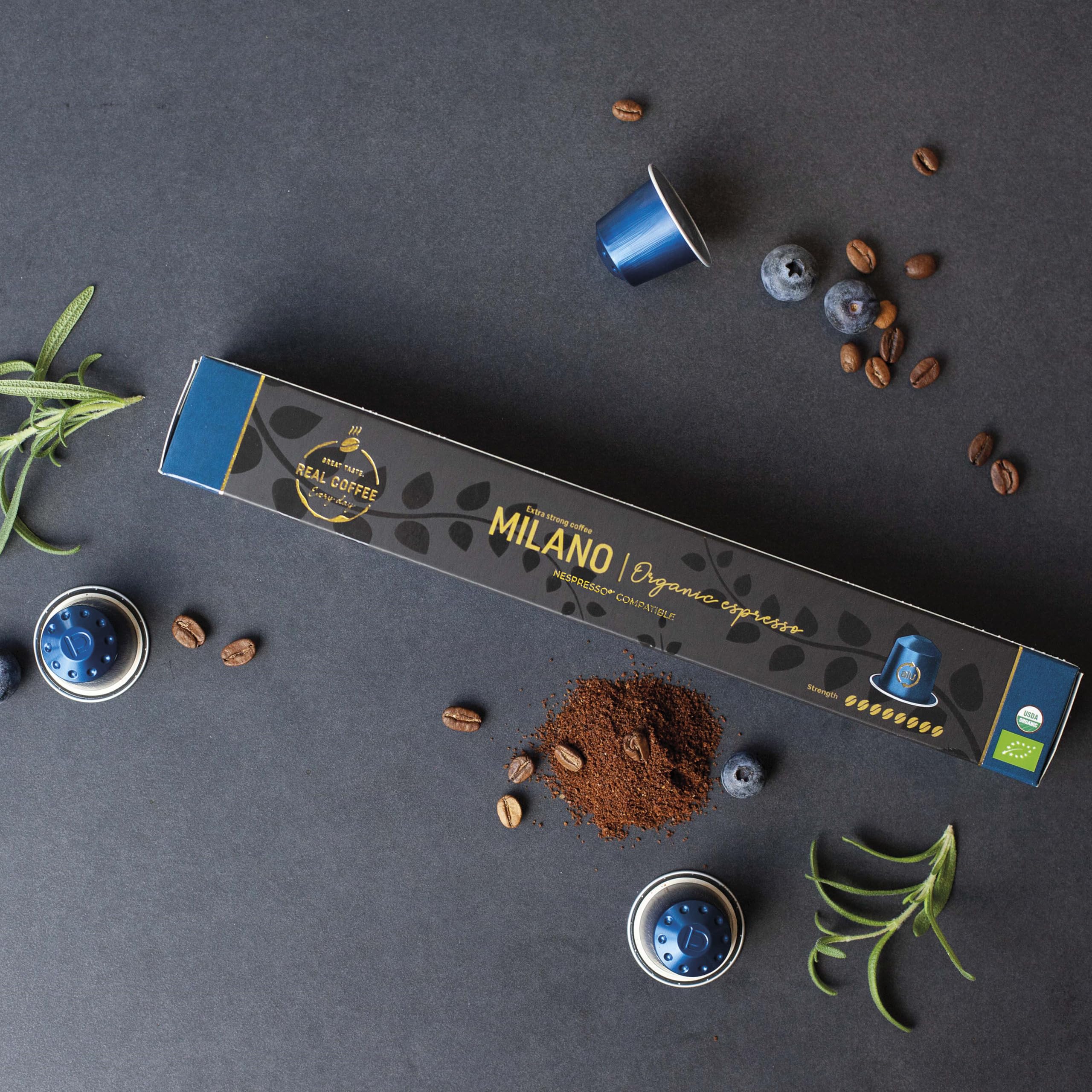 REAL COFFEE MILANO aluminium capsules close-up highlighting recyclable packaging.