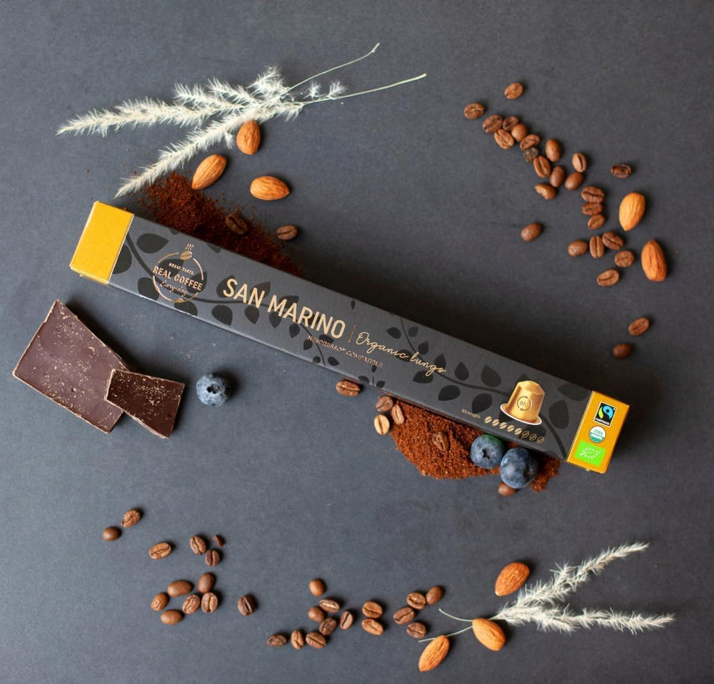 REAL COFFEE GREAT TASTE San Marino capsules closeup showing creamy crema and rich aroma