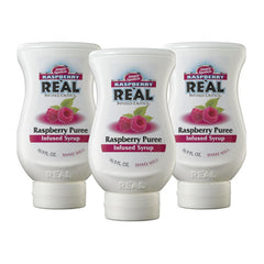 Reàl Infused Exotics Raspberry Syrup 3-pack bottles for versatile drinks.
