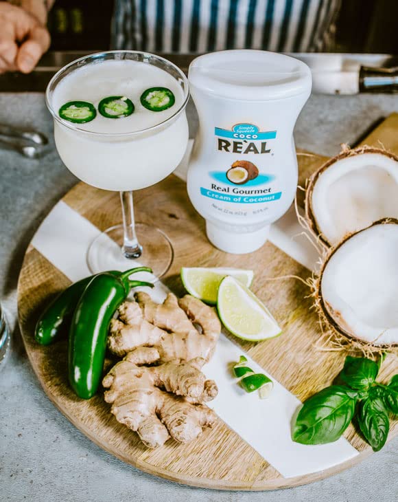 Reàl Infused Exotics squeezable bottle shown for mess-free pouring