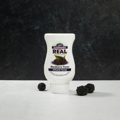Volcano-spout dispensing on Reàl Infused Exotics bottle for drip-free pouring