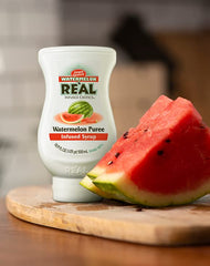 Reàl Infused Exotics Watermelon Puree Syrup in a squeezable bottle for desserts.
