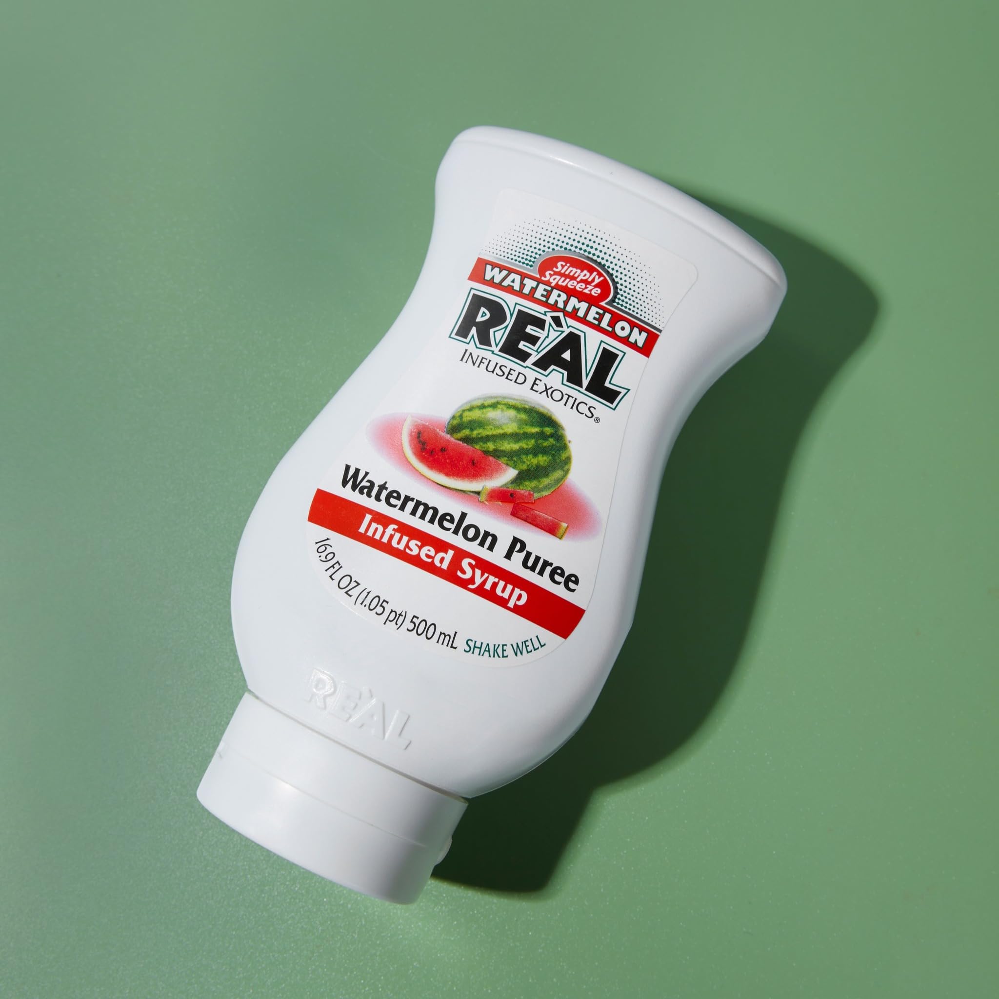 Drizzle-ready squeeze bottle design of Reàl Infused Exotics Watermelon Syrup for easy use