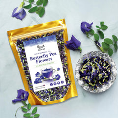 Real Naturals butterfly pea tea golden foil packaging seals freshness.