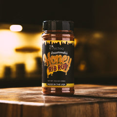 Recteq Rossarooski's Honey Rib Rub sprinkled over raw ribs for even seasoning