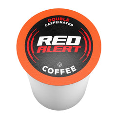 Red Alert pods beside a cup delivering a bold caffeine boost.