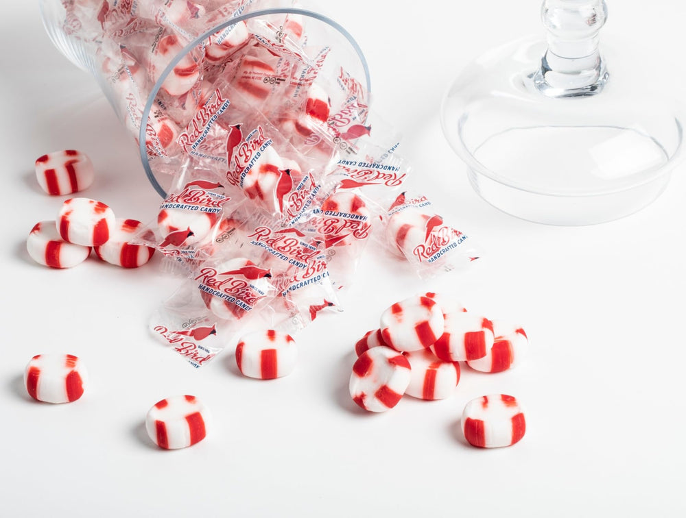 Office-ready Red Bird peppermint mints in branded packs for quick snacking.